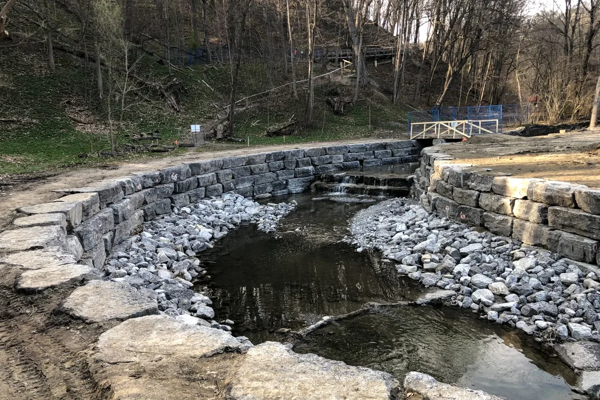 Reconstructed stream bed with large stone along channel sides