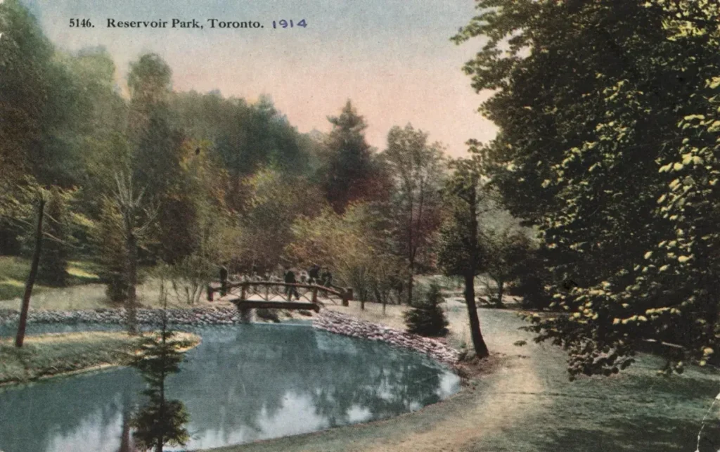 Vintage postcard of a small bridge over a pond at Reservoir Park in Toronto.
