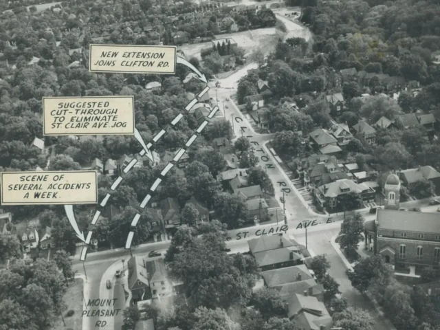 Aerial photograph of a wooded neighborhood marked with dashed lines and labels including “AIR OBSERVATION,” “SUGGESTED CUT-THROUGH,” and “SCENE OF SEVERAL ACCIDENTS A WEEK.”