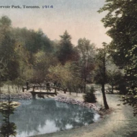 Postcard depicting a pond and footbridge at Reservoir Park, Toronto, in 1914.