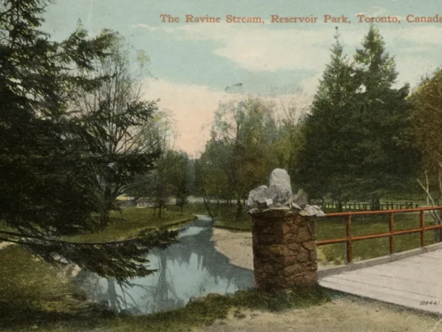A postcard view of a pond and stone bridge in Banff, Alberta, labeled “The Banff River, Vermilion Park, Alberta, Canada.”